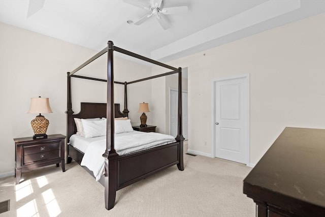 bedroom featuring baseboards, ceiling fan, and light carpet