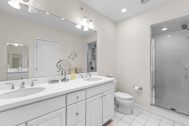 bathroom with a sink, tile patterned flooring, a stall shower, and toilet