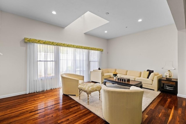 living room featuring recessed lighting, dark wood finished floors, baseboards, and a healthy amount of sunlight