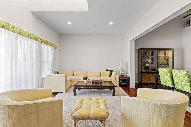living area with recessed lighting and dark wood-style flooring