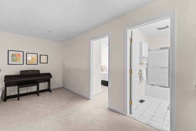interior space featuring baseboards and light colored carpet