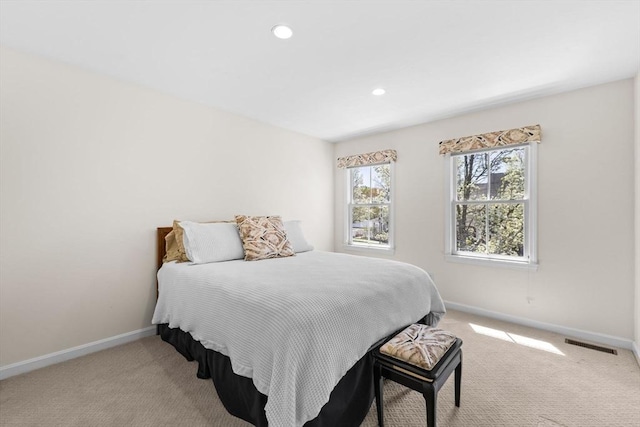 bedroom with baseboards, carpet, recessed lighting, and visible vents