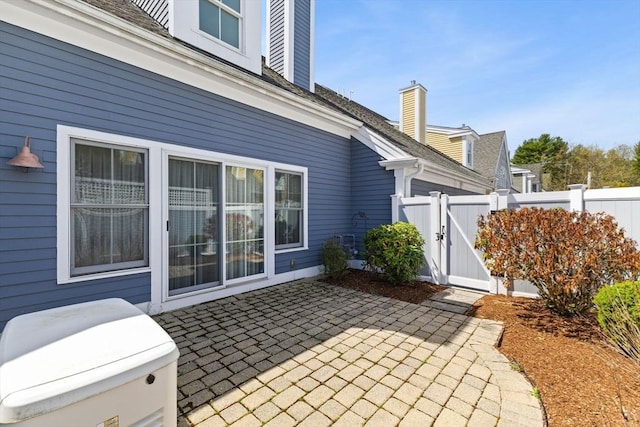 view of patio / terrace with a gate and fence