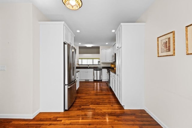 corridor with recessed lighting, baseboards, and dark wood-style floors