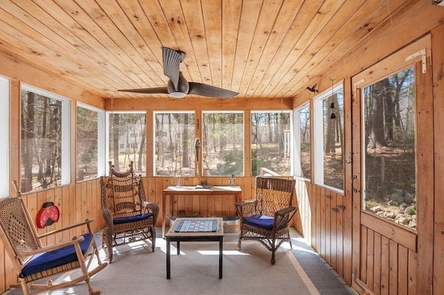 sunroom / solarium featuring ceiling fan