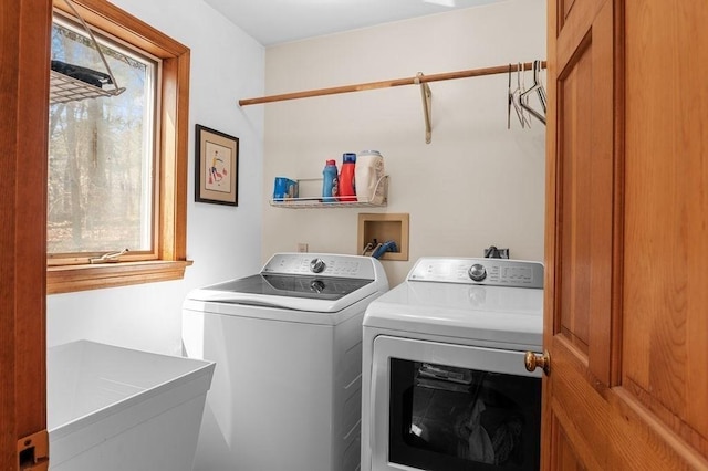laundry room with laundry area, a sink, and independent washer and dryer