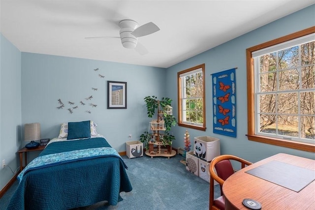 bedroom with baseboards, multiple windows, carpet, and ceiling fan