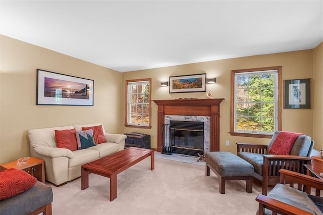 living room with a fireplace and light carpet
