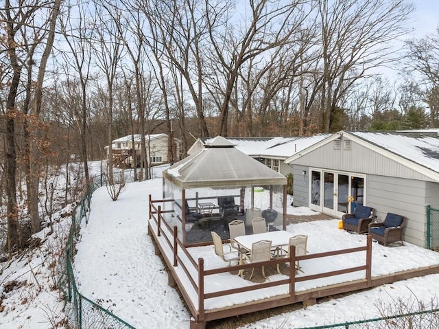 snow covered house with a gazebo