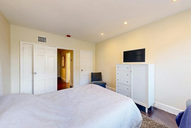 bedroom featuring dark hardwood / wood-style flooring