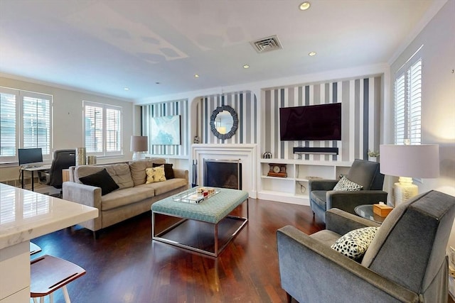 living room featuring dark hardwood / wood-style floors and a wealth of natural light