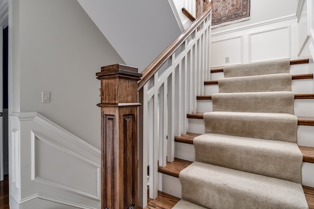 staircase featuring hardwood / wood-style floors