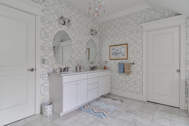 bathroom with lofted ceiling, a chandelier, dual bowl vanity, and tile floors