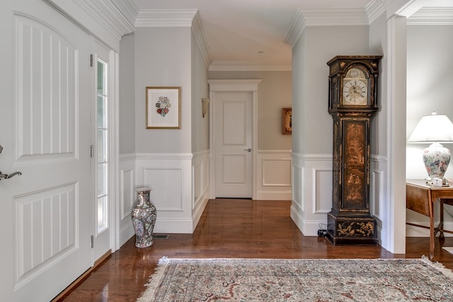 entryway with crown molding, plenty of natural light, and dark wood-type flooring