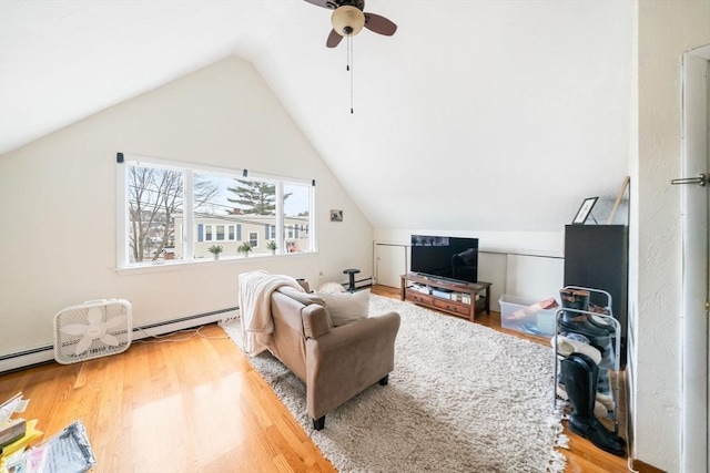 living room with vaulted ceiling, ceiling fan, and hardwood / wood-style floors