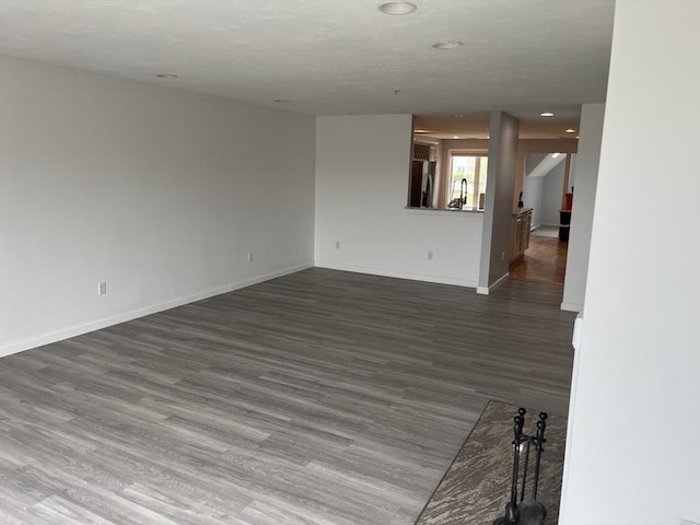 24 Highland Ter Unit 2415, Plymouth, MA 02360 - spare room featuring baseboards, dark wood-style flooring, and recessed lighting