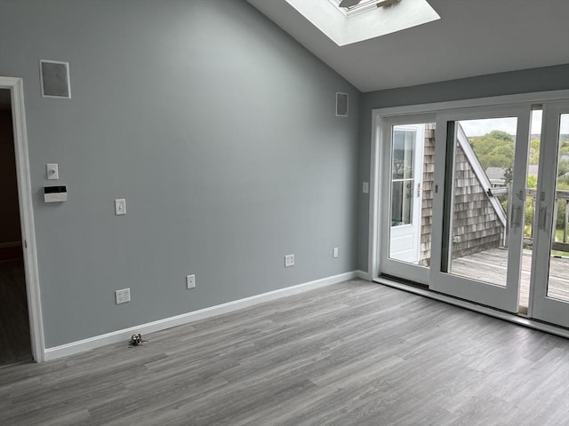 24 Highland Ter Unit 2415, Plymouth, MA 02360 - unfurnished room featuring a skylight, wood finished floors, vaulted ceiling, and baseboards
