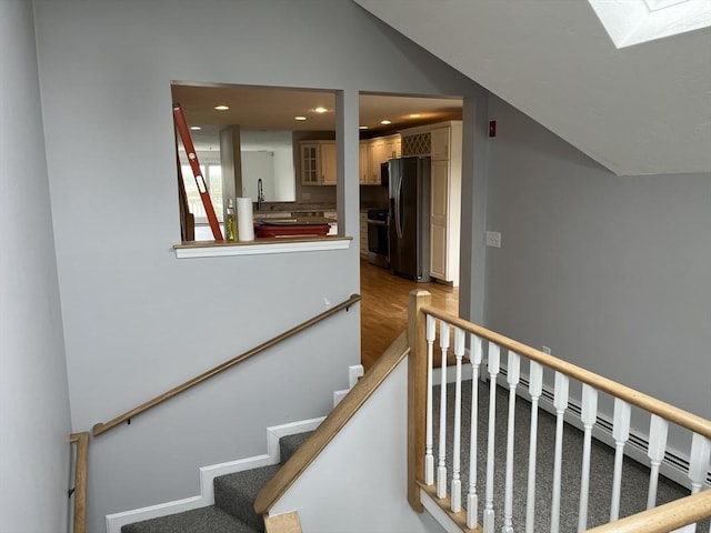 24 Highland Ter Unit 2415, Plymouth, MA 02360 - stairs with lofted ceiling, a skylight, recessed lighting, and wood finished floors