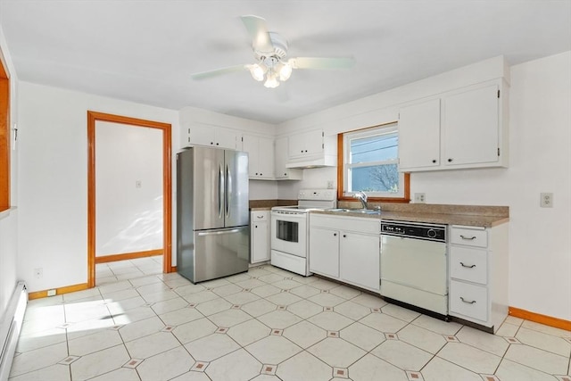 kitchen featuring white appliances, white cabinets, a baseboard heating unit, sink, and ceiling fan