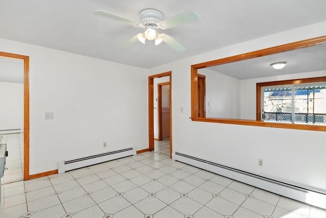 spare room featuring a baseboard radiator and ceiling fan