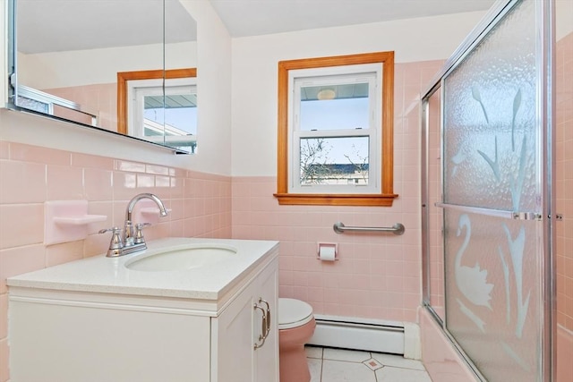 full bathroom featuring toilet, enclosed tub / shower combo, a baseboard heating unit, vanity, and plenty of natural light