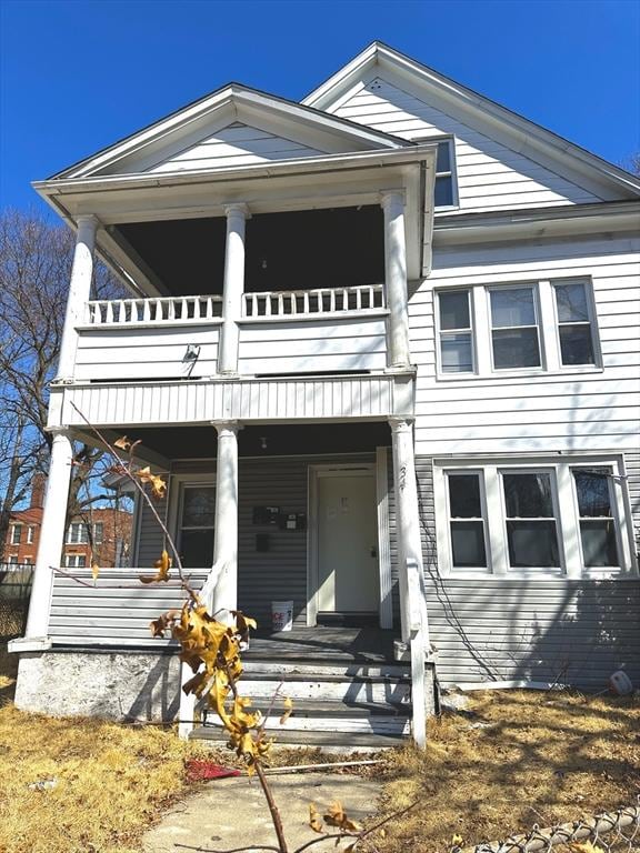 view of front of home featuring a balcony and covered porch