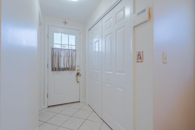 doorway featuring light tile patterned floors