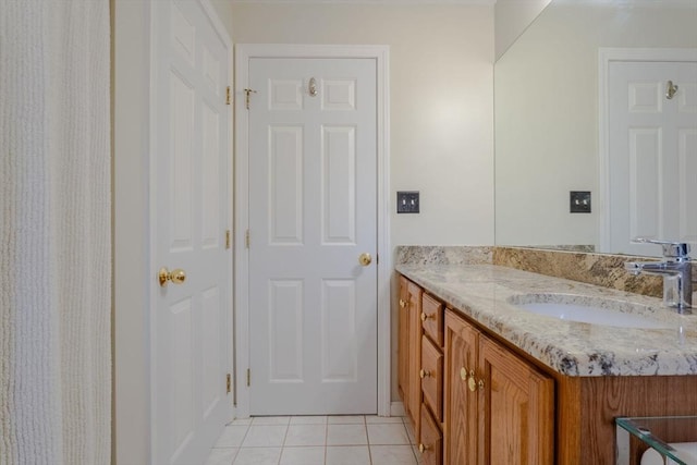 bathroom with vanity and tile patterned flooring