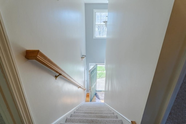 stairway featuring baseboards
