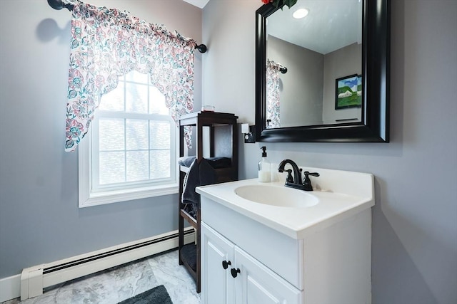 bathroom with vanity and a baseboard radiator