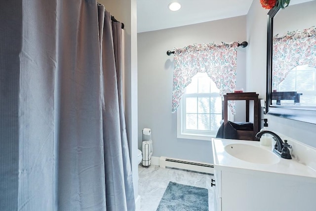 bathroom with vanity and a baseboard radiator