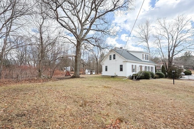 view of home's exterior featuring a lawn