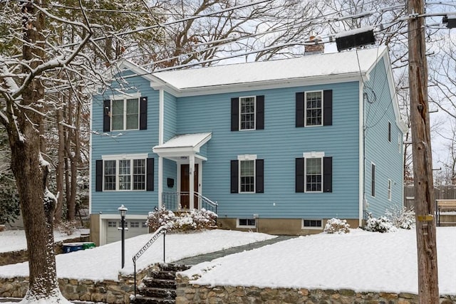 colonial house featuring a garage