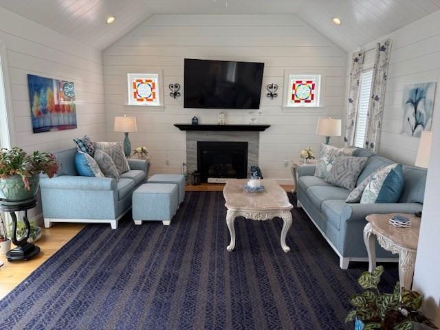 1 Karas Way, Plymouth, MA 02360 - living room featuring vaulted ceiling, wood finished floors, wood walls, a fireplace, and recessed lighting