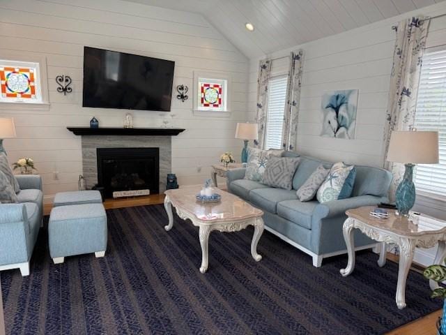 1 Karas Way, Plymouth, MA 02360 - living room with wood walls, plenty of natural light, vaulted ceiling, and a glass covered fireplace