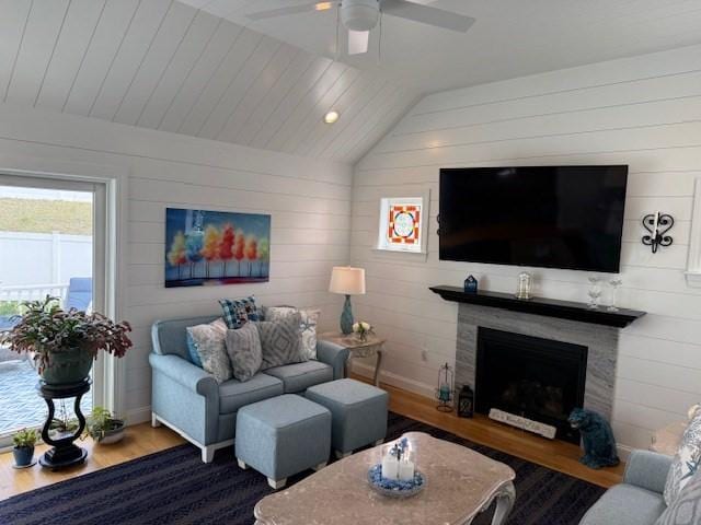 1 Karas Way, Plymouth, MA 02360 - living room with wood finished floors, a fireplace, lofted ceiling, a ceiling fan, and wood walls