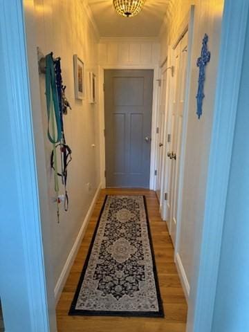 1 Karas Way, Plymouth, MA 02360 - doorway with light wood finished floors, baseboards, and ornamental molding