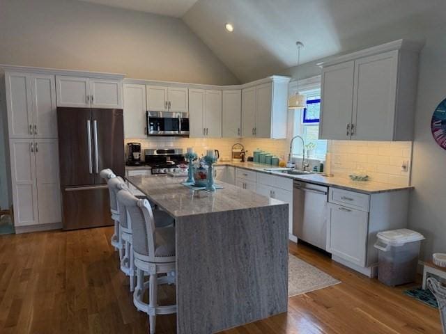 1 Karas Way, Plymouth, MA 02360 - kitchen with appliances with stainless steel finishes, a sink, white cabinetry, light stone counters, and dark wood-type flooring