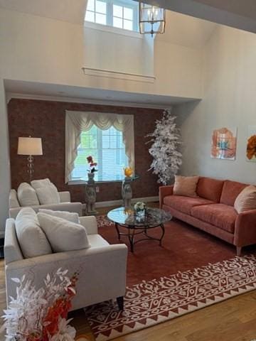 1 Karas Way, Plymouth, MA 02360 - living room with a high ceiling, wood finished floors, and a chandelier
