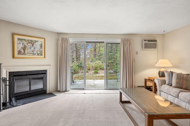 living area featuring carpet floors, a fireplace with flush hearth, and an AC wall unit