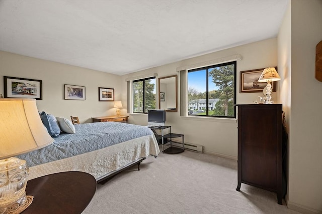 carpeted bedroom with baseboards and a baseboard radiator