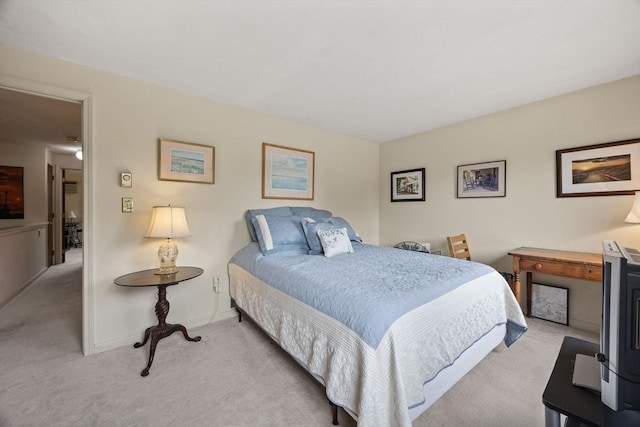 bedroom with carpet floors and baseboards
