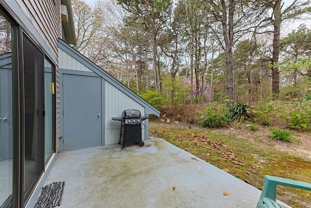 view of patio featuring a grill