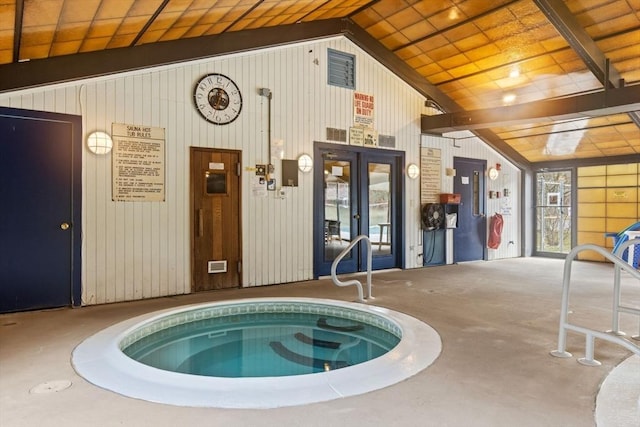 view of pool with an in-ground hot tub and french doors