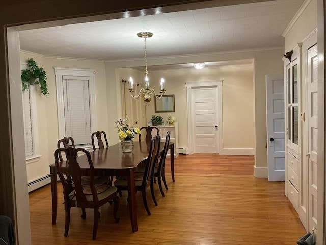 16 Knox St, Worcester, MA 01603 - dining room featuring crown molding, a chandelier, light wood finished floors, and a baseboard radiator