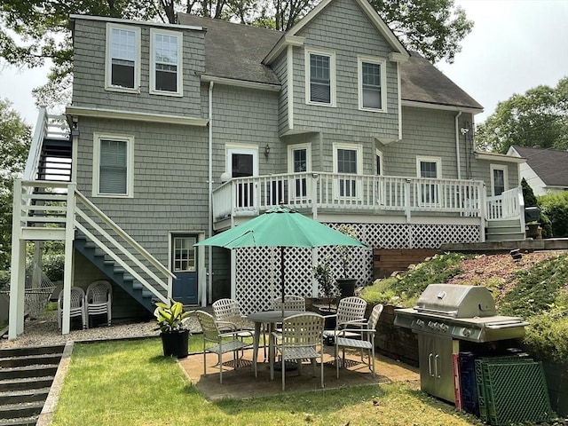 16 Knox St, Worcester, MA 01603 - rear view of house featuring stairway, roof with shingles, a patio area, and a wooden deck