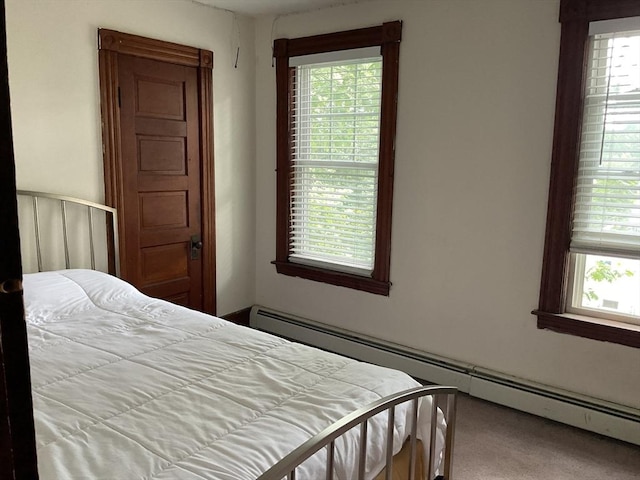 16 Knox St, Worcester, MA 01603 - carpeted bedroom with a baseboard heating unit and multiple windows