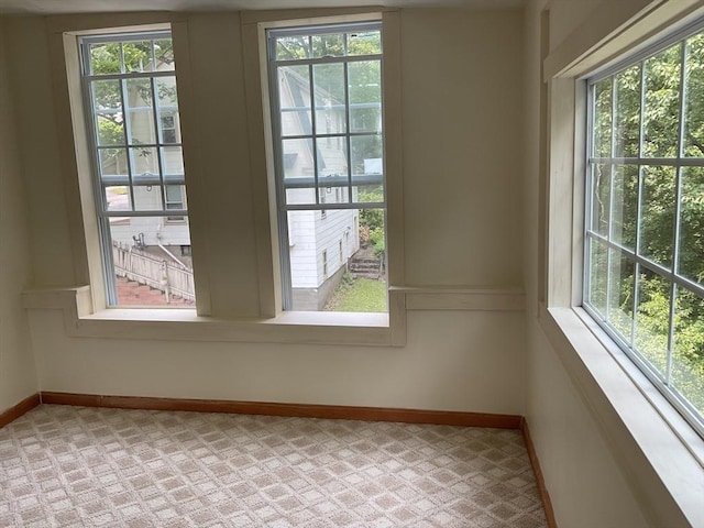 16 Knox St, Worcester, MA 01603 - empty room featuring healthy amount of natural light, baseboards, and light colored carpet