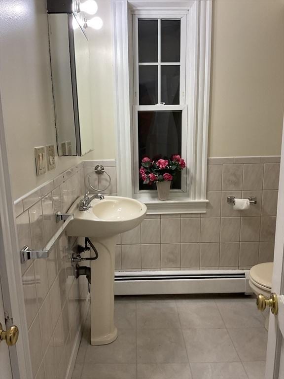 16 Knox St, Worcester, MA 01603 - half bath featuring baseboard heating, toilet, tile walls, tile patterned floors, and wainscoting