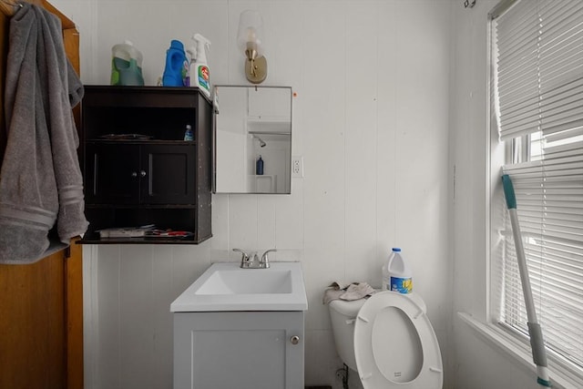 bathroom featuring toilet and vanity